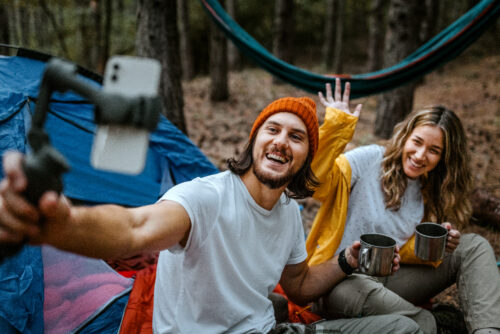 Couple taking selfie while camping